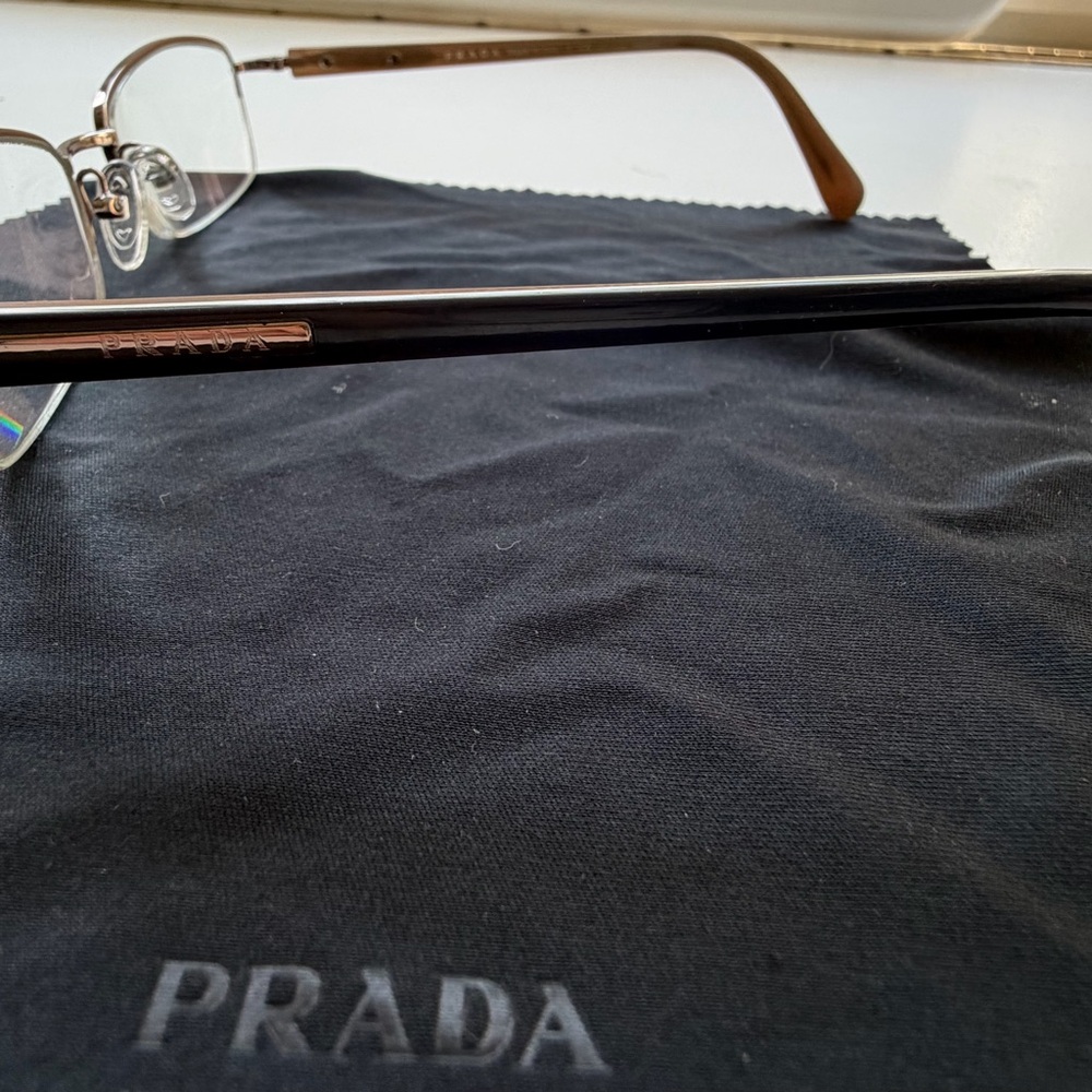 Prada Rimless Rectangle Glasses With Gold-Tone Temples And Black Case View 3